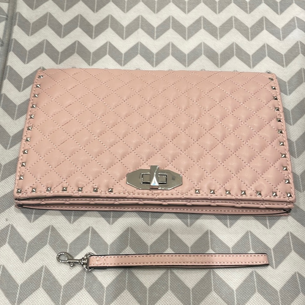 Pink studded Aldo clutch